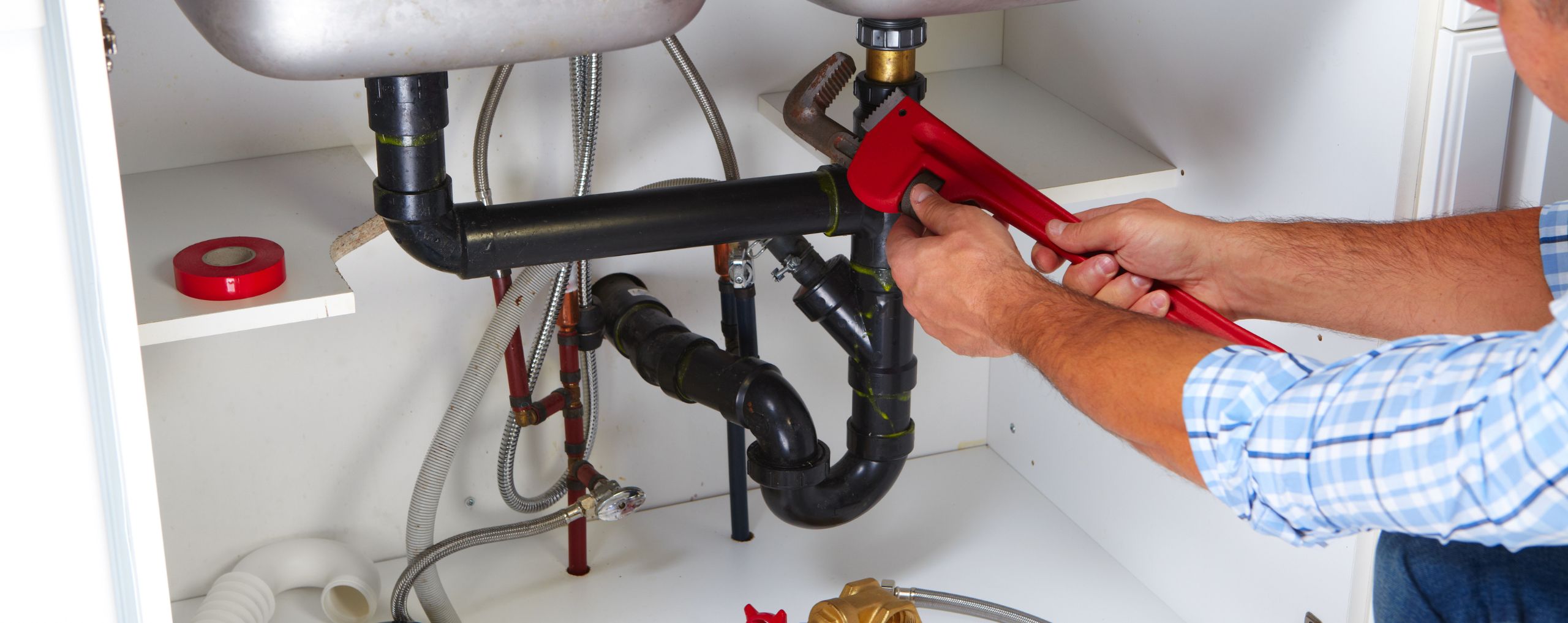 Phoenix Plumbers Fixing Pipes Under Sink